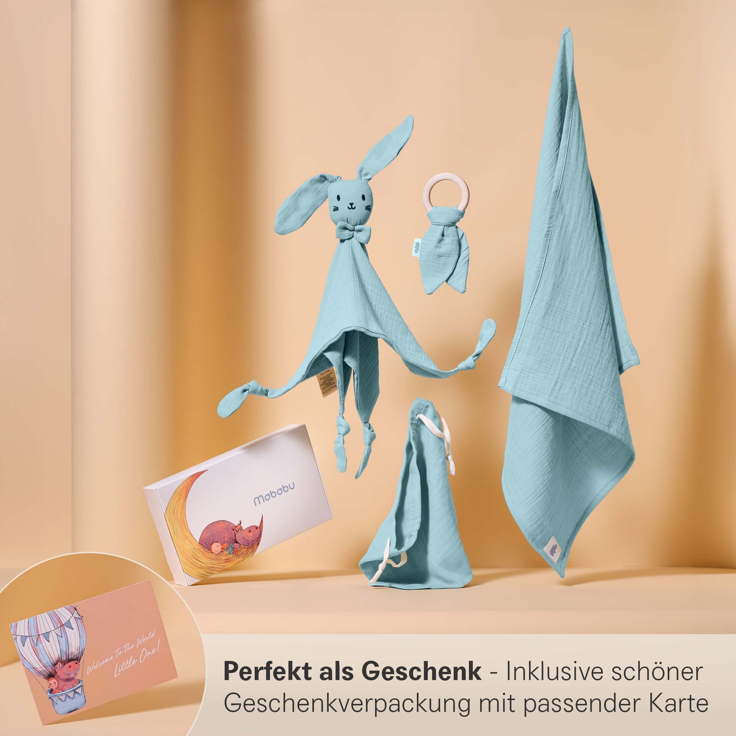 Set regalo in mussola con panno per le coccole, anello per la dentizione, panno per il ruttino e sacchetto in un'elegante confezione regalo.