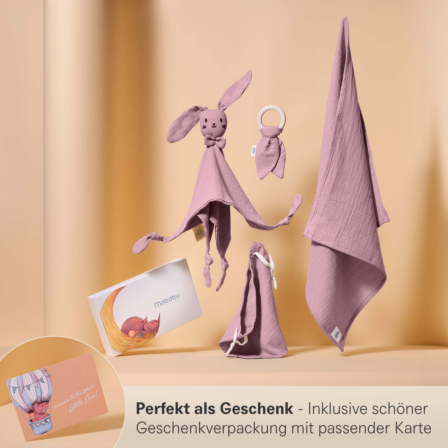 Set regalo in mussola con panno per le coccole, anello per la dentizione, panno per il ruttino e sacchetto in un'elegante confezione regalo.