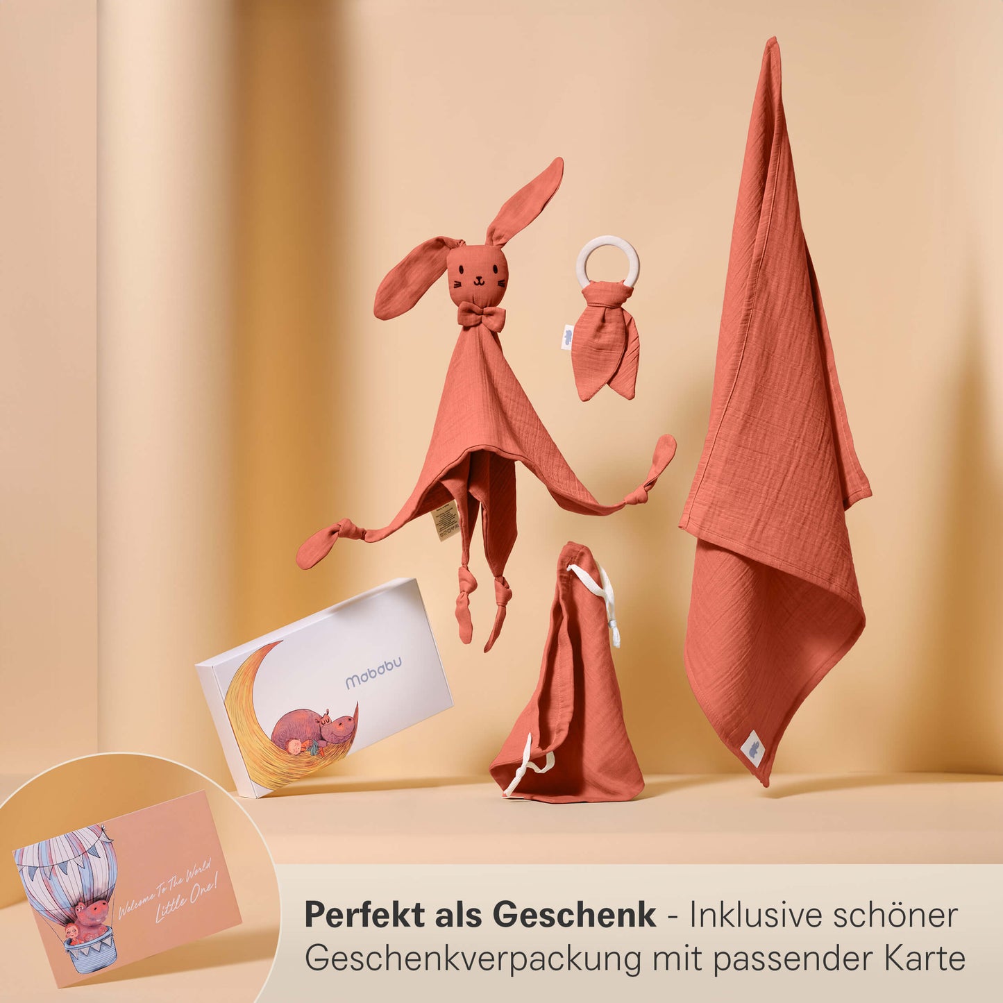 Set regalo in mussola con panno per le coccole, anello per la dentizione, panno per il ruttino e sacchetto in un'elegante confezione regalo.