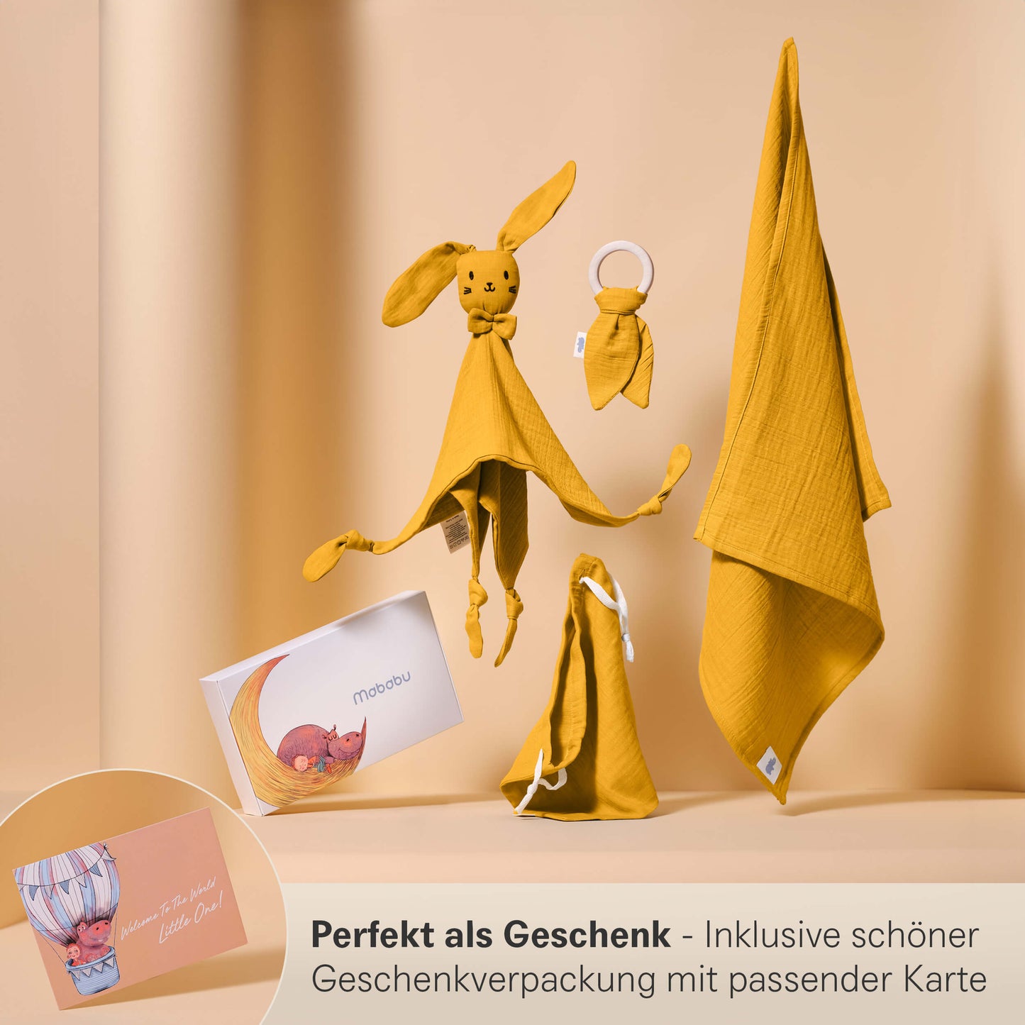 Set regalo in mussola con panno per le coccole, anello per la dentizione, panno per il ruttino e sacchetto in un'elegante confezione regalo.